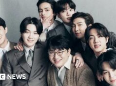 Perché la polizia sta cercando di arrestare il miliardario magnate del Ok-pop dietro i BTS